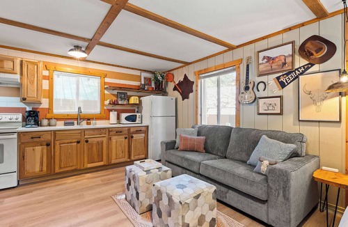 Martin City Cabin | Ditch the tent for "Retro-Chic" comfort. This spacious studio pairs high-end design with Big Sky soul—featuring a full kitchen, log-frame bed, and a modern walk-in shower. The ultimate West Glacier basecamp for your bucket-list family tour.
