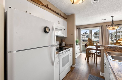 Manteo Condo | Dock Holiday: Canalfront condo, Water Views, Fisherman's dream with Boat Dock
