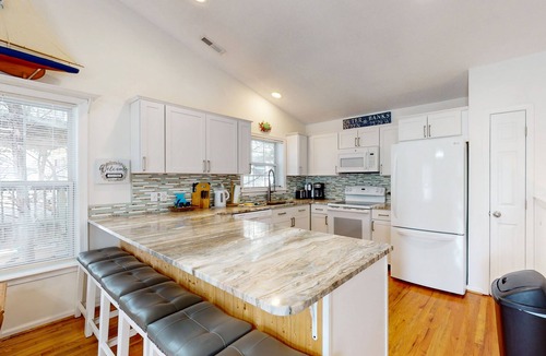 Colington Harbour House | Dog-friendly home with game room, furnished deck, & pool access