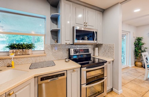Miami Gardens House | Dog-friendly home with large yard, updated interior, Ping-Pong, & lawn games