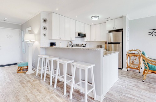 Fenwick Island Condo | East of the Sun condo with screened porch, fast WiFi, W/D, AC, and pool