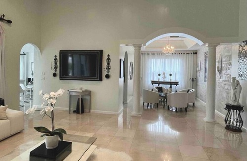 Coral Springs House | Elegant home private pool private patio bar with TV on lake