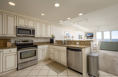 Ocean City Condo | Enjoy a large, spacious designer unit with all the extras plus an indoor pool, outdoor pool, fitness room, assigned parking and shops on the ground level.