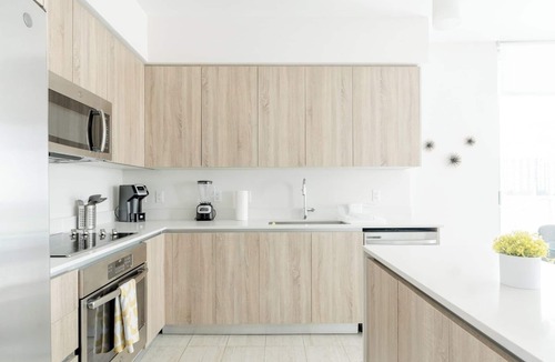 Northeast Miami Apartment | Enjoy a panoramic view of the pool and Miami’s stunning sunsets This.