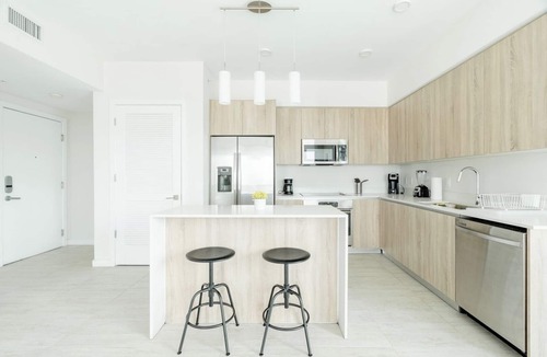 Northeast Miami Apartment | Enjoy a panoramic view of the pool and Miami’s stunning sunsets This.