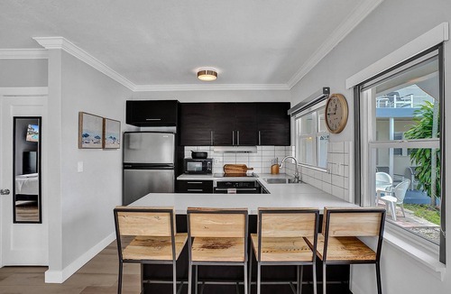 East Fort Lauderdale Condo | Enjoy scenic sunsets on your private deck. Modern condo minutes to the beach.