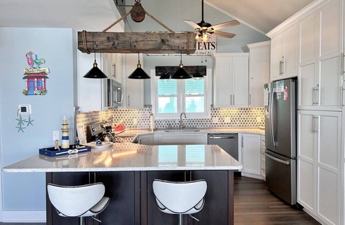 Oak Island House | Experience oceanfront bliss at Summer Wind West in Oak Island! Ideal for 12 guests.