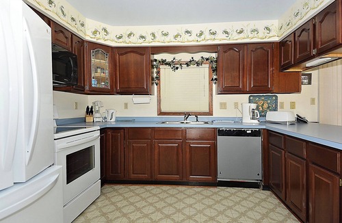 Sandpiper Pines House | FREE DAILY ACTIVITIES!! Lovely 4 bedroom + Den, (Two Master Bedrooms) 3.5 bath home, located on the canal, with boat dock, 2 car garage,just a short walk to the lifequarded beach.