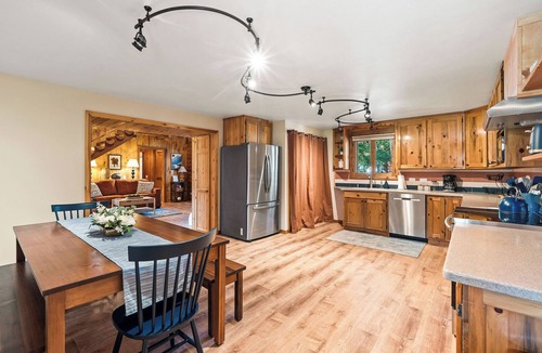 Martin City Cabin | Fully rehabbed log cabin, 15 min to Glacier. 3 queen beds across 2 bedrooms, 2 full baths, fully stocked kitchen, pellet stove & a game loft stocked with 100 movies. The Montana family cabin your family will never stop talking about.