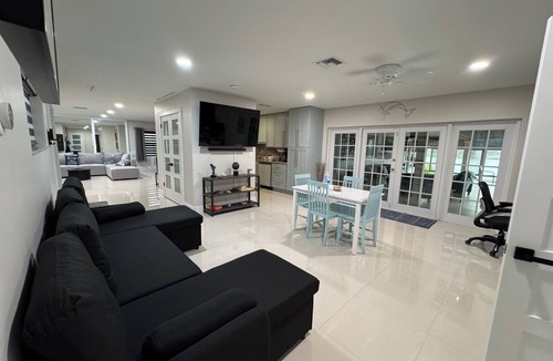 Miami Lakes House | Lake Front Home w Game Room, Hot Tub Swim Spa, Gym & Dock minutes from Hard Rock