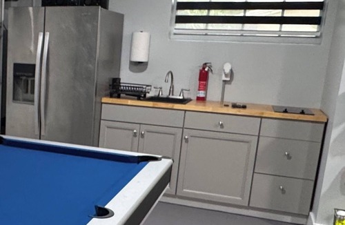 Miami Lakes House | Lake Front Home w Game Room, Hot Tub Swim Spa, Gym & Dock minutes from Hard Rock