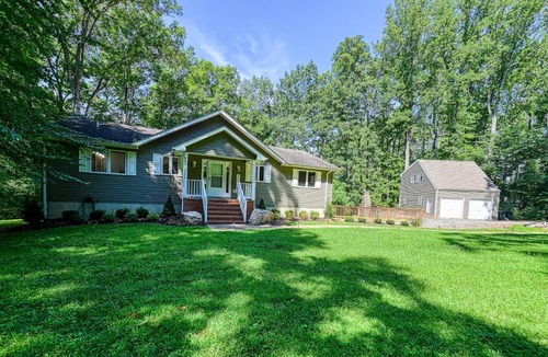Livingston House | Lakefront home with deck, hot tub, game room, kayaks, & fireplace