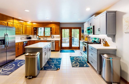 Lakeside Woods House | Lakefront home with hot tub, WiFi, dock, lake views, AC, & wood fireplace