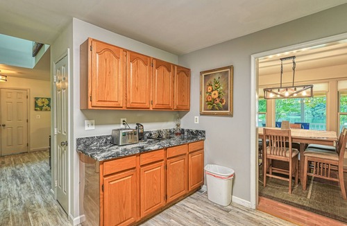 Bumpass House | Lakefront home with spacious deck, dock, game room, hot tub, & sunset views