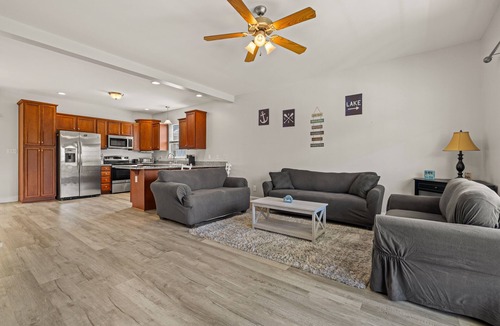 Louisa House | Lakeview escape near beach with fenced dog run, porch & dock with one boat slip
