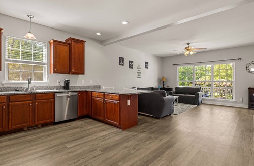 Louisa House | Lakeview escape near beach with fenced dog run, porch & dock with one boat slip