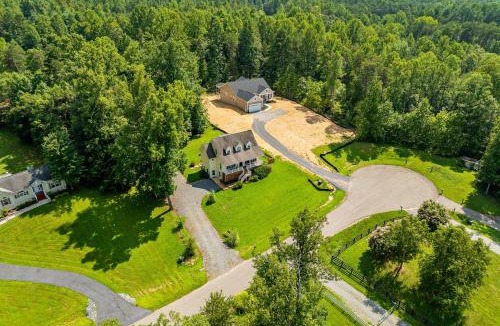 Louisa House | Lakeview escape near beach with fenced dog run, porch & dock with one boat slip