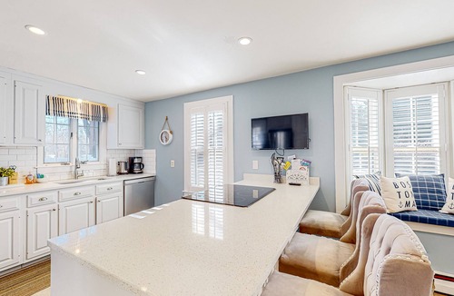 Cotuit House | Lovell's Pond Retreat - remodeled home with sunroom, steps to secluded pond