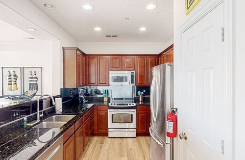 Sandbridge Condo | Luxe, 2-story condo with ocean views, balcony, fast WiFi & on-site pool/gym