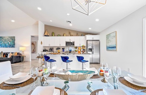 Delray Beach House | Luxe Heated Pool Home, Tiki Hut, Bar, Air Hockey!