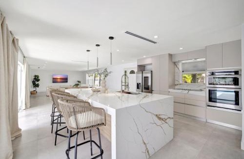Coral Ridge Isles House | Luxury Waterfront Villa with Heated Pool and Dock