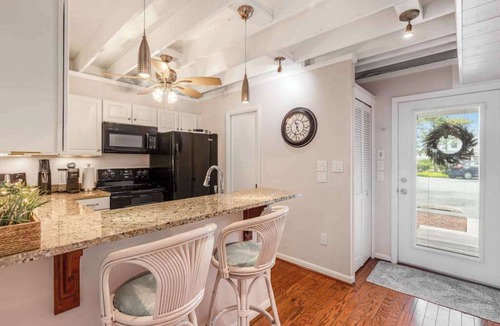 Selbyville House | Mallard Lakes townhouse with hot tub, pool, water views, & fireplace