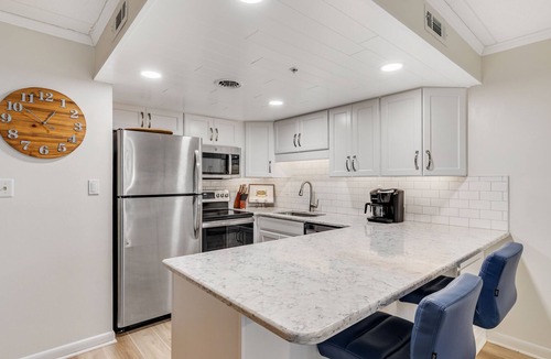 Ocean City Condo | Marlin marina-view getaway with pool & balcony - walk to pier & Jolly Roger