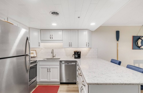 Ocean City Condo | Marlin marina-view getaway with pool & balcony - walk to pier & Jolly Roger