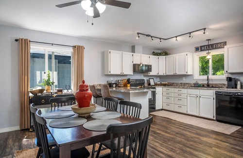 Kalispell House | Mid-Way on 3rd, Sleeps 10, Sauna and Firepit with tow living rooms and fenced back yard