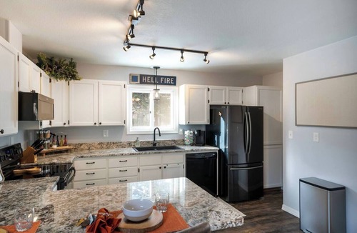 Kalispell House | Mid-Way on 3rd, Sleeps 10, Sauna and Firepit with tow living rooms and fenced back yard