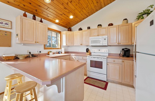 Bigfork Condo | New! Home on Golf Course, Fireplace, Spacious Deck
