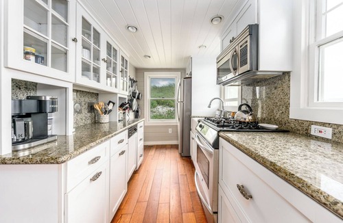 East Sandwich Cottage | Ocean front oasis with renovation nestled in the dune on a private beach.