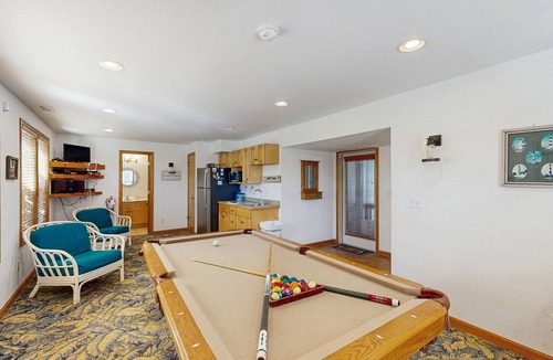 Waves House | Oceanfront home with private hot tub, outdoor pool, fireplace, & game room