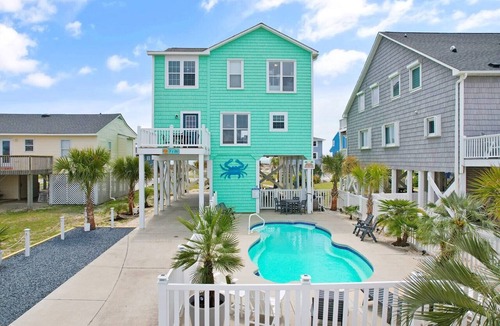 Long Beach Hotel | Oceanview Key Rest on Oak Island: Spacious 6BR, 5BA home for 15 guests with pool.