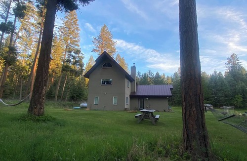 Finley Point House | Orchards & old growth forest surround this Finley Point Home.