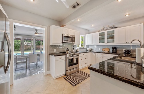 Poinsettia Heights House | Oversized Saltwater Pool! Private & Peaceful Tropical Chic Oasis!
