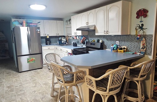 Mystic Island House | *Pet-Friendly Waterfront Tiki Escape with Fire Pit, bars, screened in porch