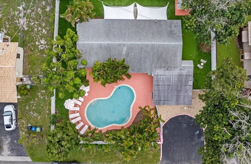 Coral Ridge Villa | Pink Palm Pool Paradise: Perfect Place for Photos
