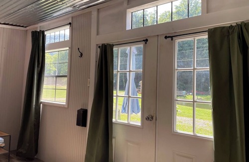 Northern Cabin | Pond front cabin flooded with sunlight, just steps away from throwing a line in.