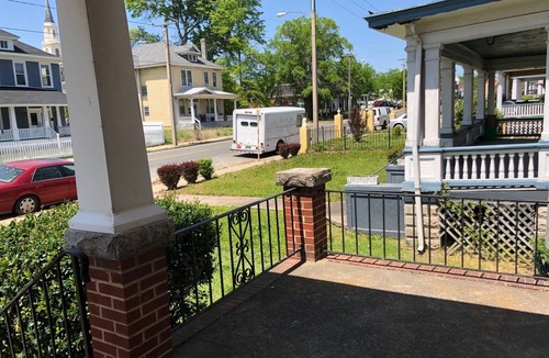 Mosby House | Relax in beautiful second floor apartment with balcony & private fenced yard.