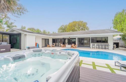 Imperial Point House | Resort Style Backyard Heated Pool Hot Tub Fire Pit