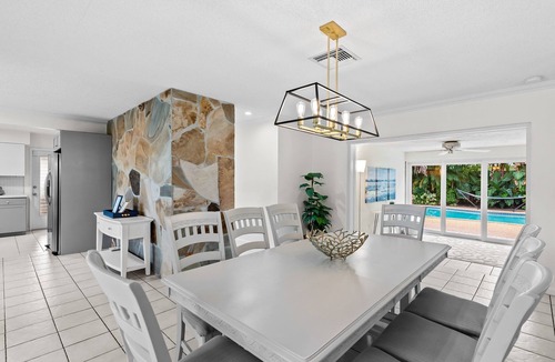 Lighthouse Point House | Retro 1950s Florida Home ~ Solar Heated Pool ~ Spa ~ Tiki Hut ~ Huge Backyard ~ Hammock ~ Two Bikes