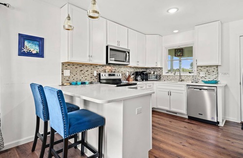 Captain's Cove House | Salty Sea Lyons Landing | Golf Views, Screened Porch, Fireplace, Pool Access, Pet Friendly