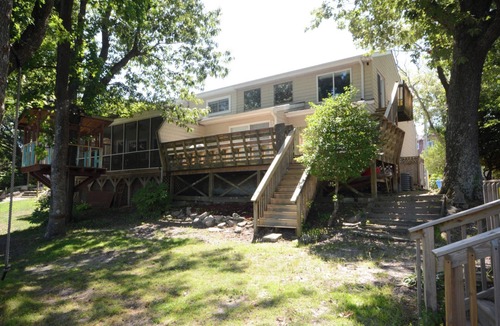 Croatan Beach House | Sat-Sat rental. A stunning view of Lake Christine & short walk to Croatan beach!