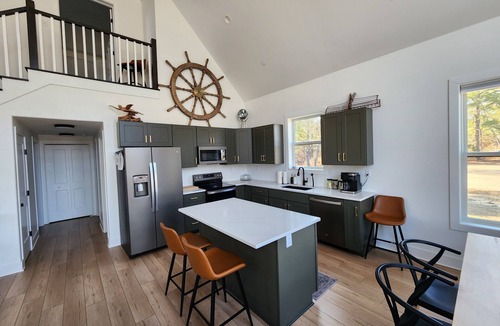 Marion Station House | Secluded waterfront getaway with hot tub,fire pit, and private dock.