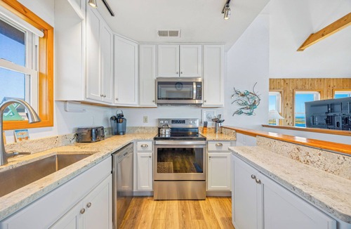Avon House | Soundfront Home w/Private Boat Dock, Game Room, Windsports Access, & More!