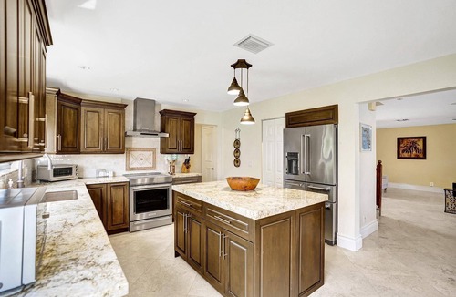 Deerfield Beach Villa | Spacious 4 bedroom, 3 bath Villa with Screened-In Heated Pool, Gourmet Kitchen