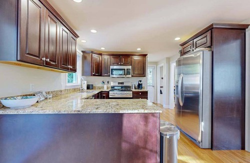 Mashpee House | Spacious home close to Peters Pond Beach with porch, AC, W/D, & water view