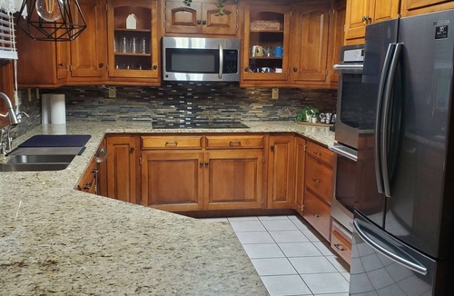 Killbuck House | Spacious home! Large deck, patio, waterfalls, koi pond, hot tub & massage chair!