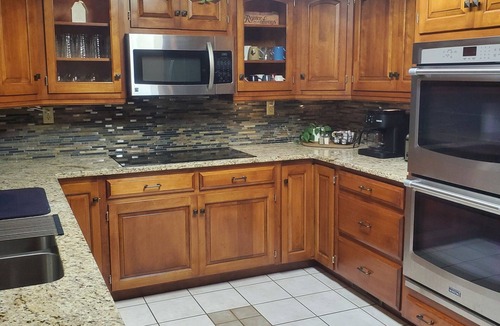 Killbuck House | Spacious home! Large deck, patio, waterfalls, koi pond, hot tub & massage chair!